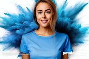 An attractive woman in front in a blue t-shirt and an explosion of blue pigment in the back.